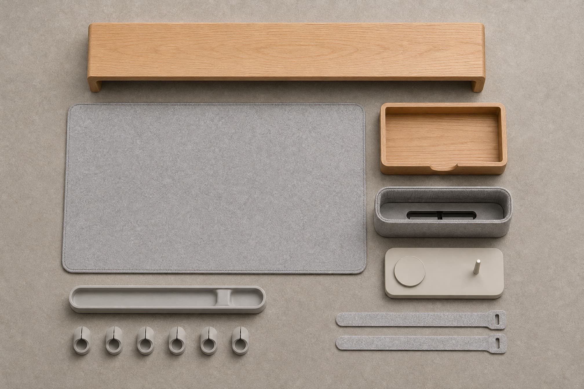 Every Desk Core Pro Kit piece separated and aligned in rows on a stone-grey surface.
